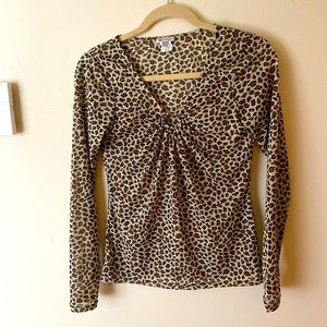 Very light almost sheer animal print top with decorative neck line in gold